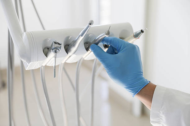 Professional Tooth Extraction technician working in Central City, IA